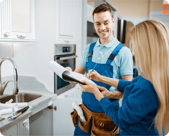 Contractor discussing kitchen renovation plans with a homeowner